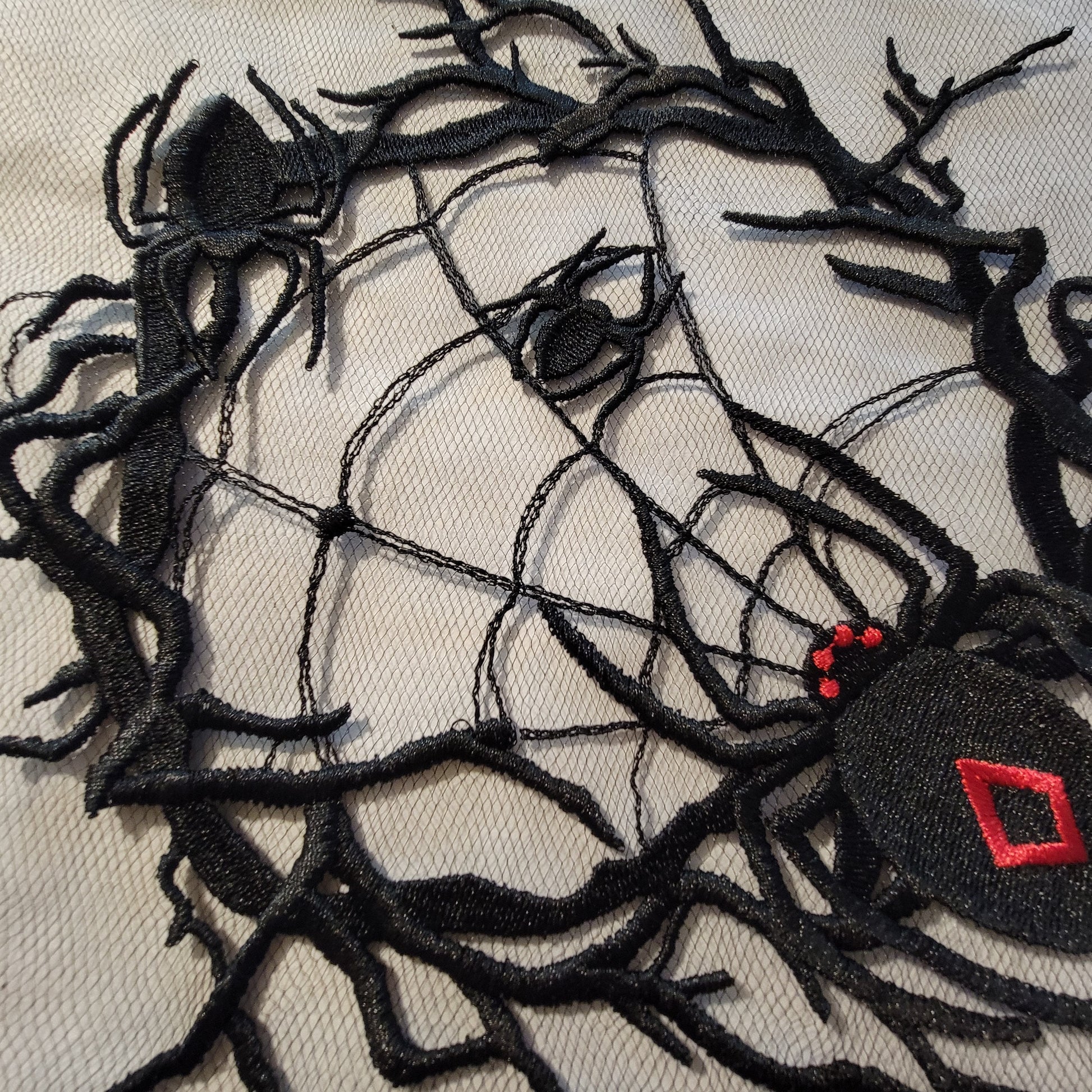 Spider and Spider Web stitched on on Black or White Tulle