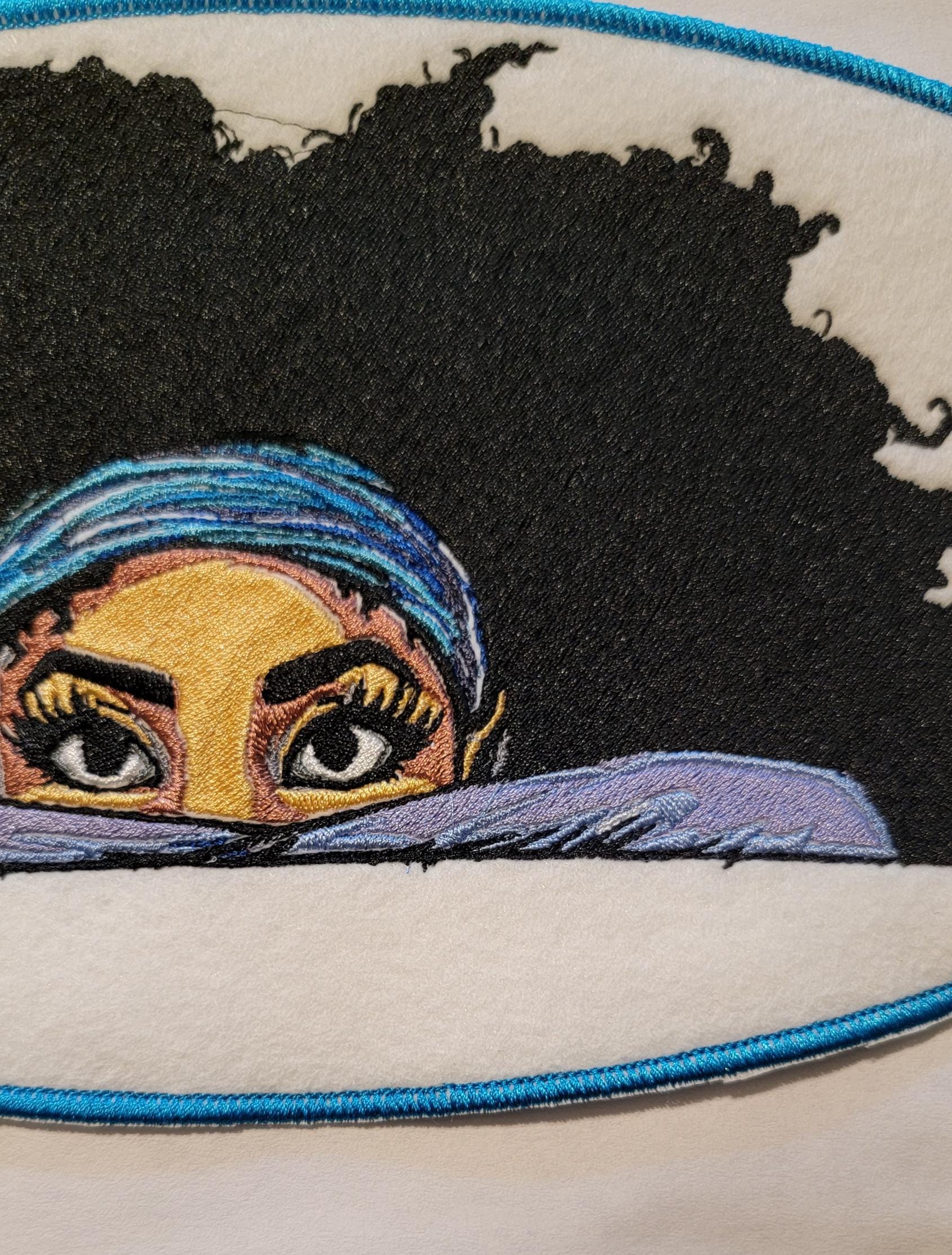 Playful Embroidered Patch features a whimsical young lady peeking over the top of her folded arms, ready for adventure!