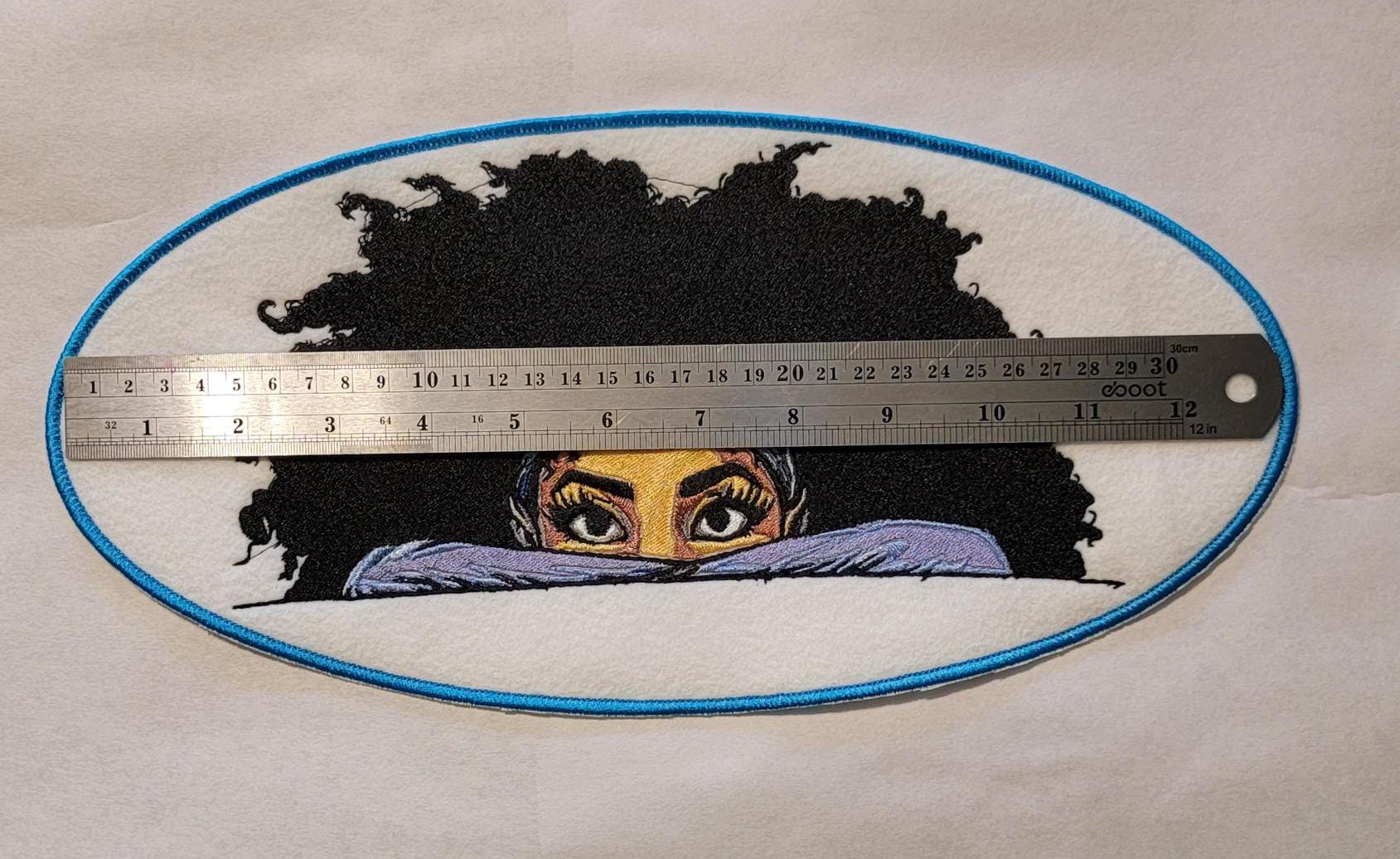 Playful Embroidered Patch features a whimsical young lady peeking over the top of her folded arms, ready for adventure!