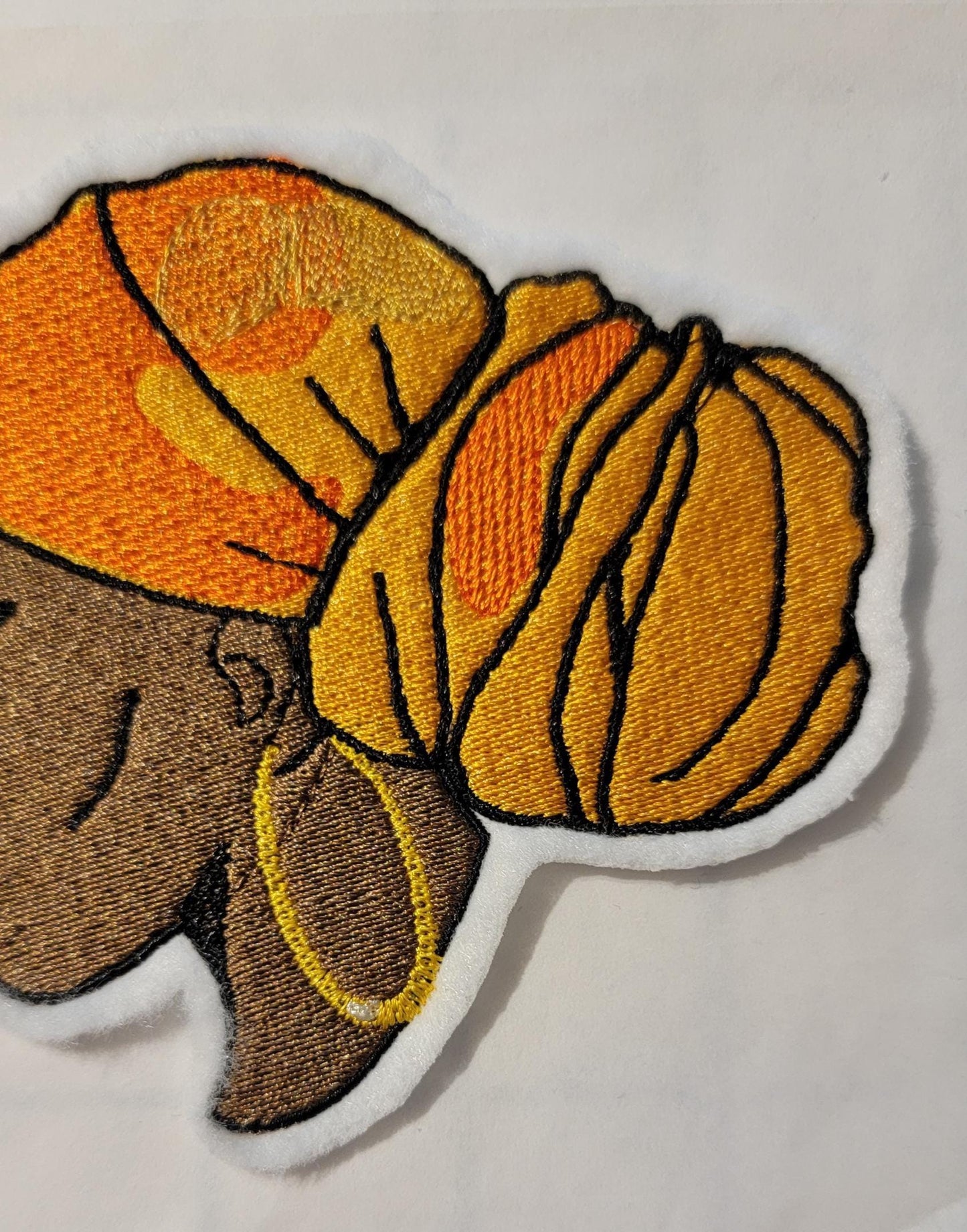 Regal Beauty in Gold Headwrap – Embroidered Patch